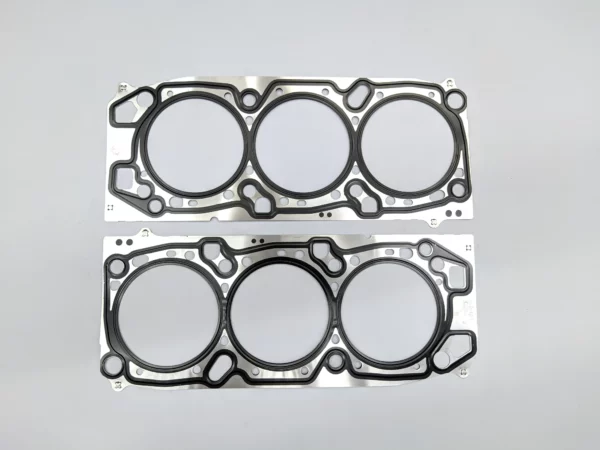 EMPACADURA DE CAMARA MD163051 (DCH1215) MITSUBISHI MONTERO SPORT, PAJERO FULL, ENDEAVOR 03-UP (SET)
